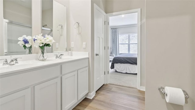 3026 Audrey Dr, Hempfield Twp Wml, PA 15601 - ensuite bathroom featuring double vanity and wood finished floors