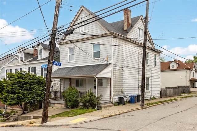 17 Lelia St, Mt Washington, PA 15211 - view of front of house with covered porch, a chimney, and a shingled roof