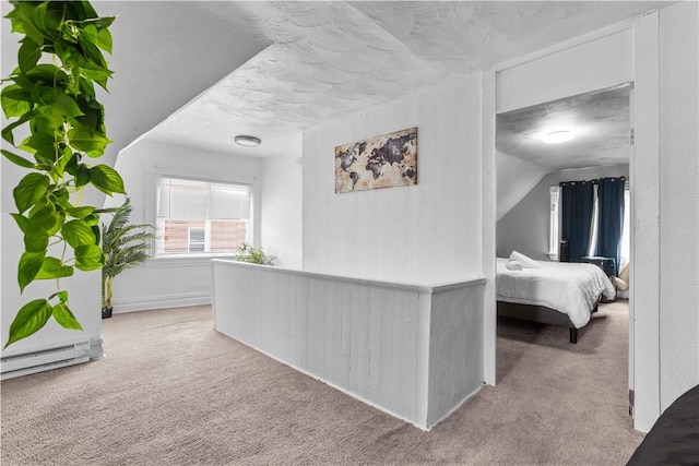 17 Lelia St, Mt Washington, PA 15211 - hallway with carpet, a baseboard heating unit, a textured ceiling, and vaulted ceiling