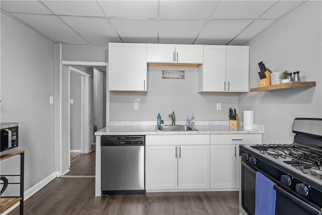 17 Lelia St, Mt Washington, PA 15211 - kitchen with appliances with stainless steel finishes, a sink, a paneled ceiling, white cabinetry, and dark wood-style floors