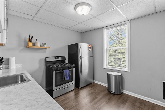 17 Lelia St, Mt Washington, PA 15211 - kitchen with stainless steel appliances, a drop ceiling, a sink, light countertops, and dark wood-style flooring
