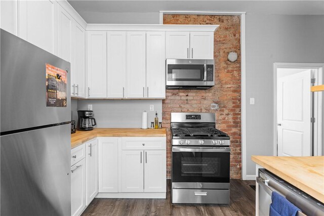17 Lelia St, Mt Washington, PA 15211 - kitchen featuring appliances with stainless steel finishes, wooden counters, dark wood-style flooring, and white cabinets