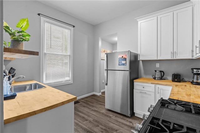17 Lelia St, Mt Washington, PA 15211 - kitchen with wood counters, freestanding refrigerator, a sink, dark wood-type flooring, and white cabinets