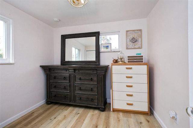 interior space with light wood-type flooring and baseboards