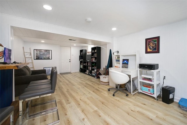 home office featuring wood finished floors, recessed lighting, and visible vents