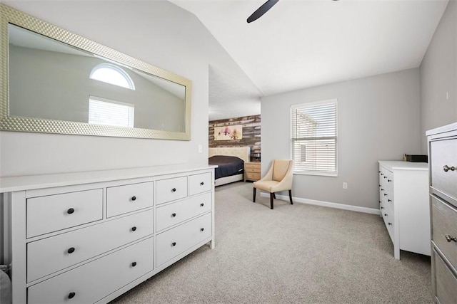 sitting room featuring lofted ceiling, ceiling fan, baseboards, light carpet, and a fireplace