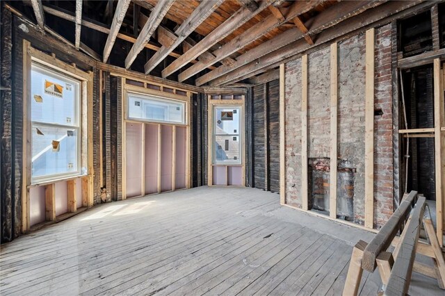 misc room with a wealth of natural light and wood-type flooring
