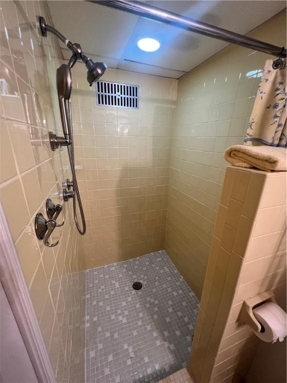 full bathroom with a shower stall