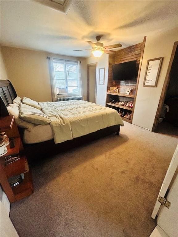 carpeted bedroom with attic access and ceiling fan