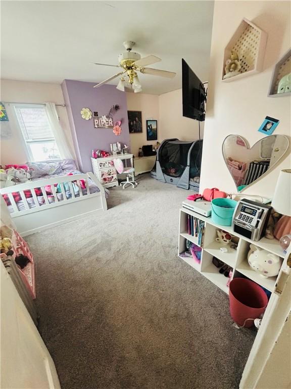 game room with ceiling fan and carpet floors