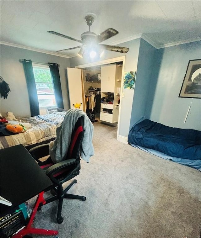 bedroom featuring ornamental molding, a closet, ceiling fan, and carpet floors