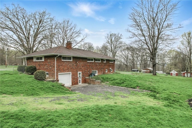 940 Fredonia Rd, Perry Twp Mer, PA 16130 - rear view of property with a chimney, brick siding, a yard, and an attached garage