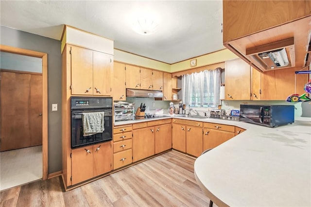 940 Fredonia Rd, Perry Twp Mer, PA 16130 - kitchen featuring a sink, under cabinet range hood, light wood-style floors, black appliances, and light countertops