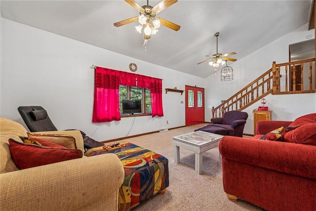 living room with stairs, carpet floors, vaulted ceiling, baseboards, and a ceiling fan