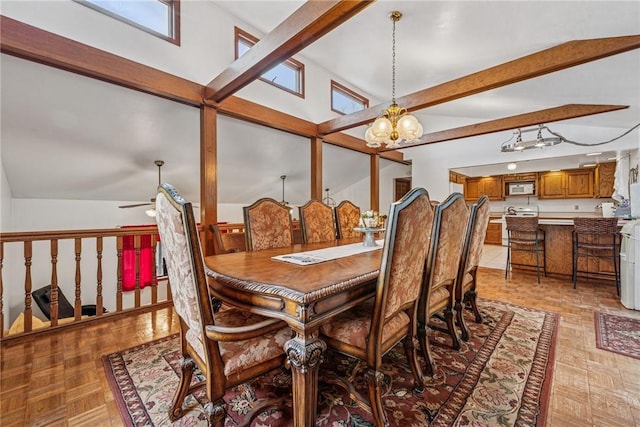 dining area with vaulted ceiling with beams and ceiling fan with notable chandelier