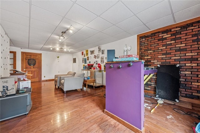 interior space featuring wood finished floors and baseboards
