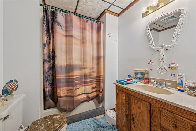 full bathroom featuring toilet, visible vents, shower / bath combo with shower curtain, and vanity