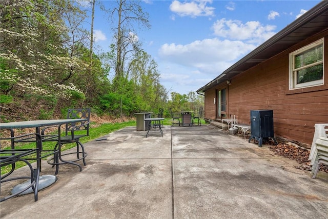 view of patio featuring outdoor dining area