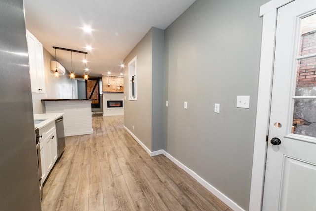 3052 Phelan Way, Polish Hill, PA 15219 - hall with light wood-type flooring and baseboards