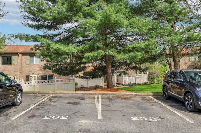 uncovered parking lot with fence