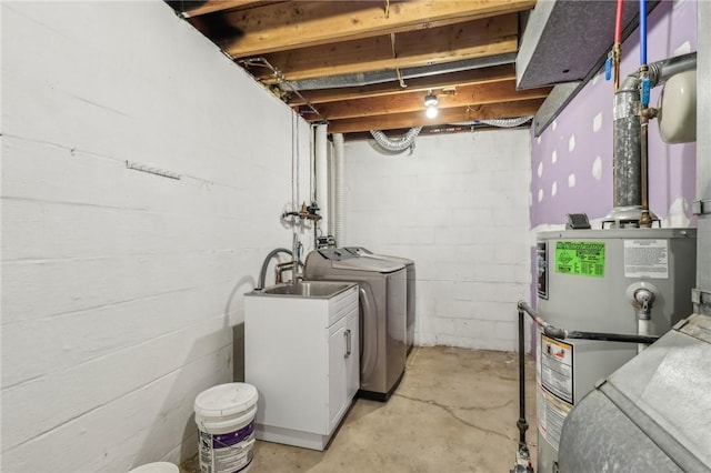 washroom with laundry area, independent washer and dryer, and water heater