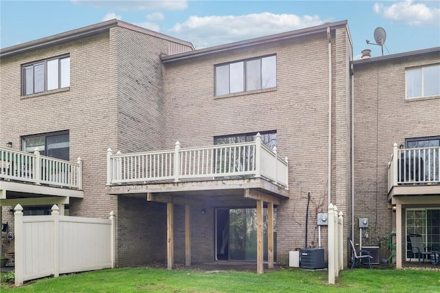 rear view of house with brick siding