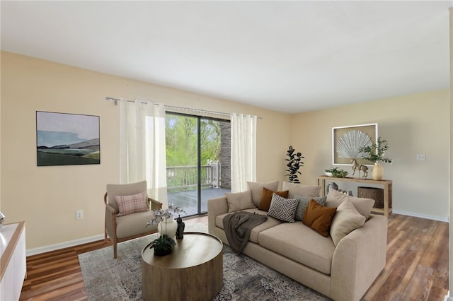 living room with baseboards and wood finished floors