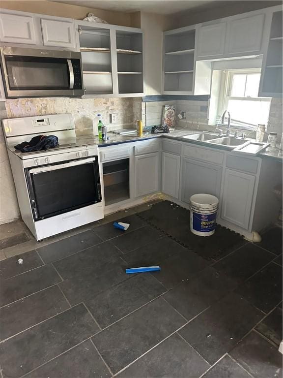 10 Welsh Way S, Side, PA 15203 - kitchen with stainless steel microwave, a sink, white gas range oven, open shelves, and white cabinetry