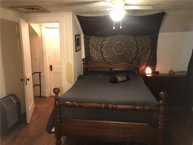 bedroom featuring wood finished floors and ceiling fan