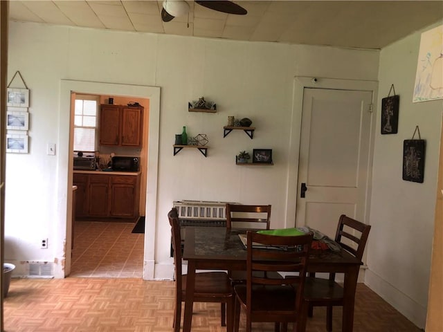 dining area with a ceiling fan