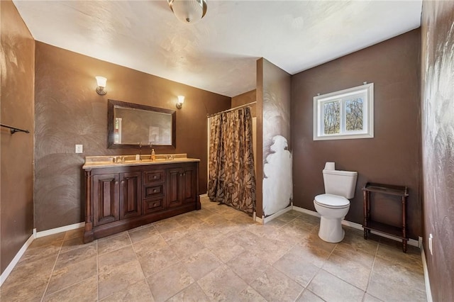 116 Dutchtown Rd, Sewickley Twp, PA 15637 - bathroom with toilet, double vanity, a shower with shower curtain, and baseboards