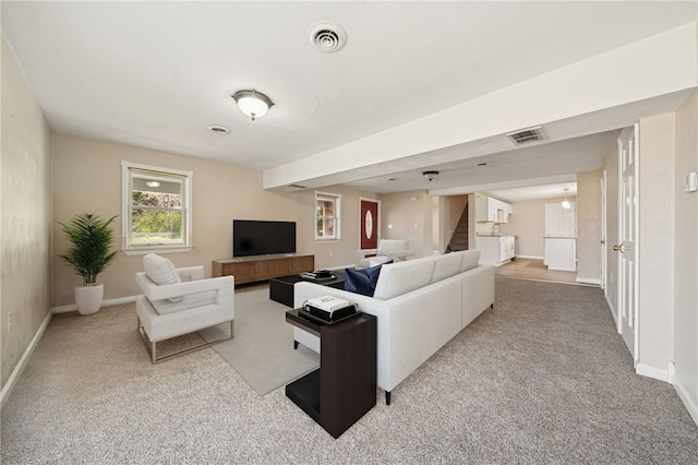 116 Dutchtown Rd, Sewickley Twp, PA 15637 - carpeted living room featuring baseboards, visible vents, and stairs