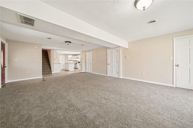 116 Dutchtown Rd, Sewickley Twp, PA 15637 - unfurnished living room featuring carpet flooring, stairs, visible vents, and baseboards