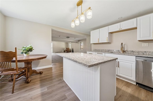 116 Dutchtown Rd, Sewickley Twp, PA 15637 - kitchen featuring light wood-style flooring, a kitchen island, dishwasher, white cabinets, and open floor plan