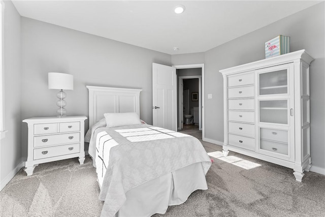 carpeted bedroom featuring baseboards
