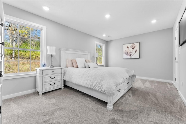 carpeted bedroom with baseboards and recessed lighting