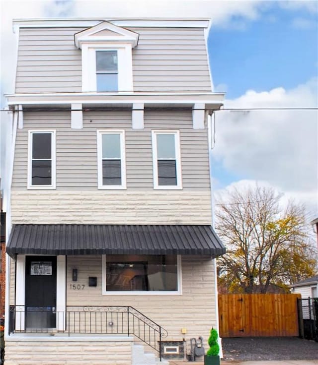 1507 Allegheny Ave, Manchester, PA 15233 - second empire-style home featuring fence and a porch