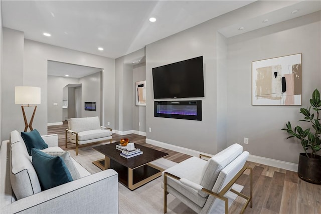 1507 Allegheny Ave, Manchester, PA 15233 - living room with light wood finished floors, recessed lighting, baseboards, and a glass covered fireplace