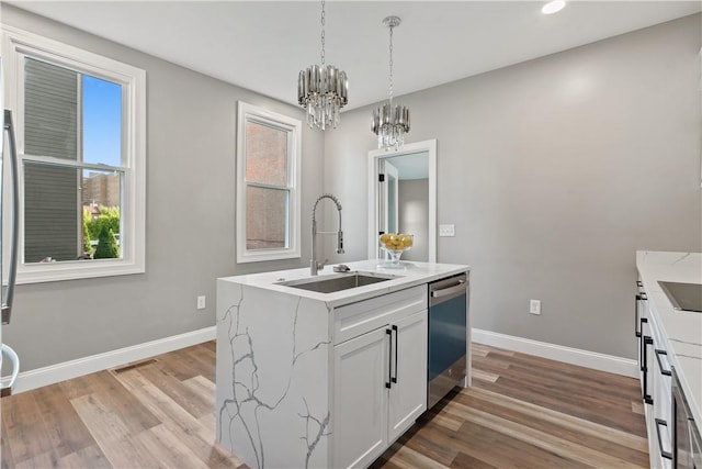 1507 Allegheny Ave, Manchester, PA 15233 - kitchen featuring baseboards, a notable chandelier, dishwasher, and a sink