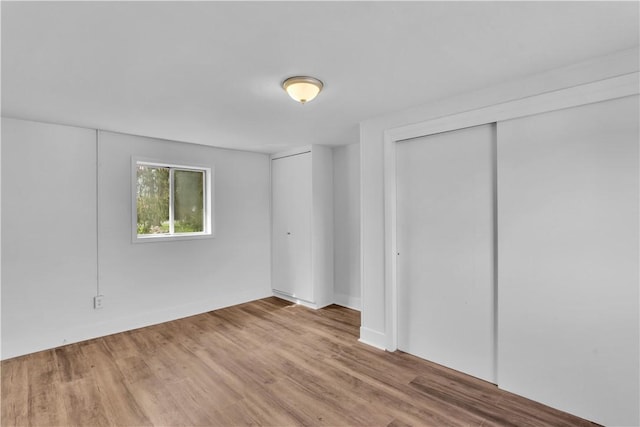 unfurnished bedroom with wood finished floors