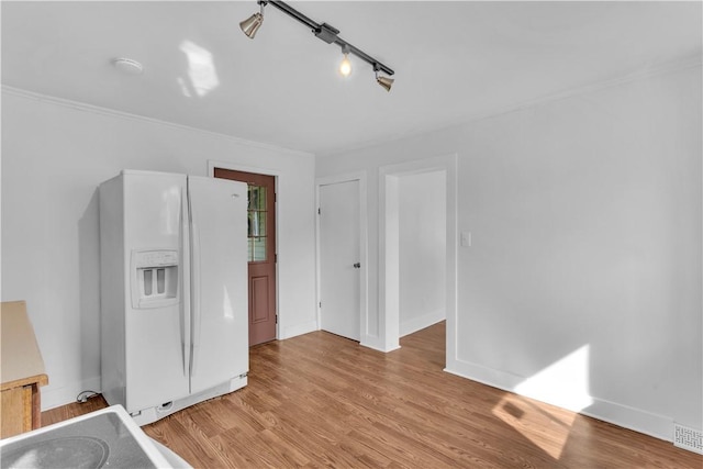 interior space with light wood-style flooring and baseboards