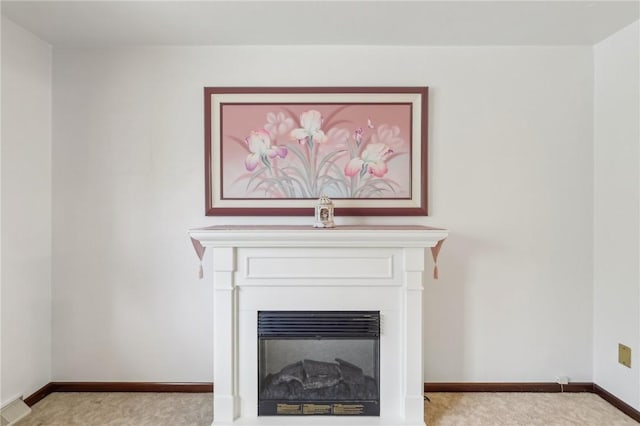 room details with visible vents, baseboards, carpet, and a fireplace