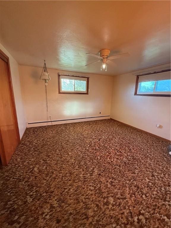 318 Hamburg Rd, Hempfield Twp Mer, PA 16125 - empty room with a ceiling fan, plenty of natural light, carpet flooring, and a baseboard heating unit