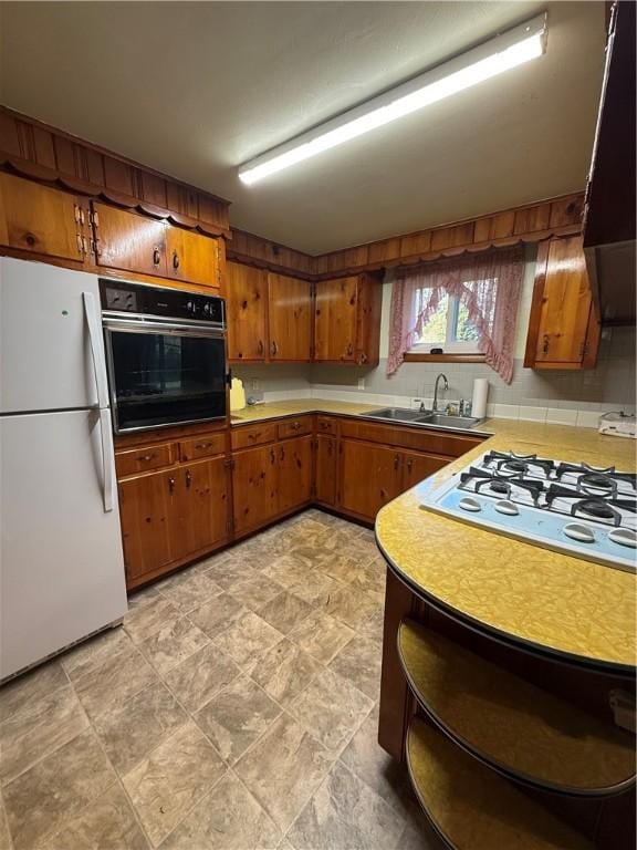 318 Hamburg Rd, Hempfield Twp Mer, PA 16125 - kitchen with white appliances, open shelves, light countertops, brown cabinets, and a sink