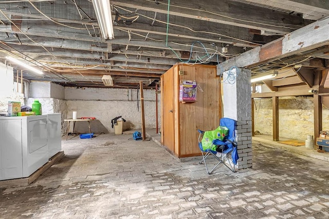 unfinished basement featuring separate washer and dryer