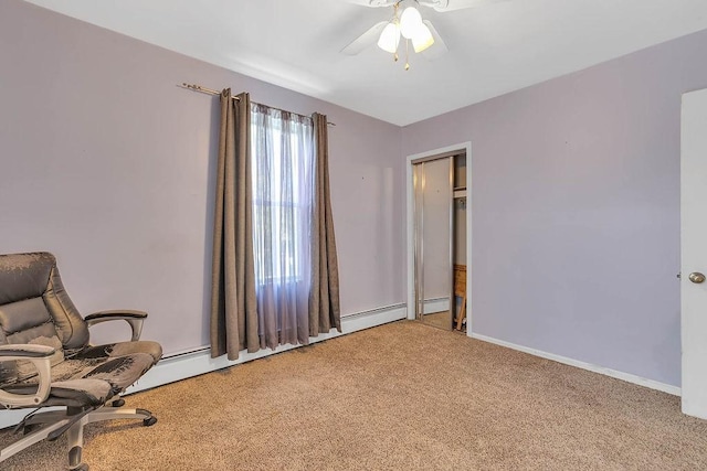 sitting room featuring ceiling fan, carpet flooring, and baseboards