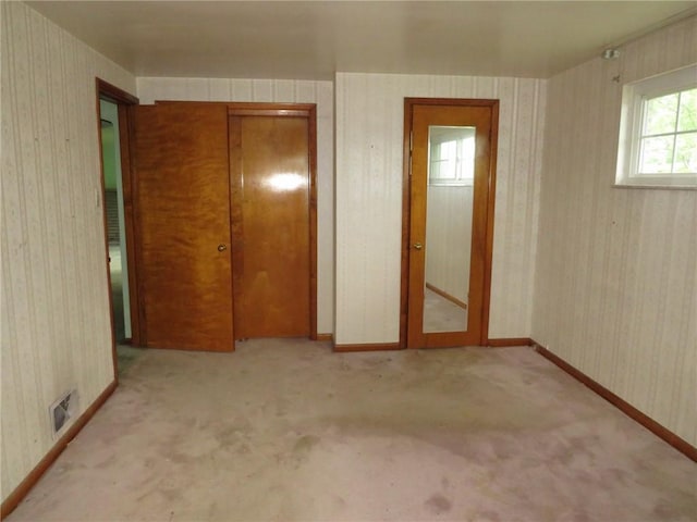 1185 Colgate Dr, Monroeville, PA 15146 - unfurnished bedroom featuring wallpapered walls, a closet, and carpet floors