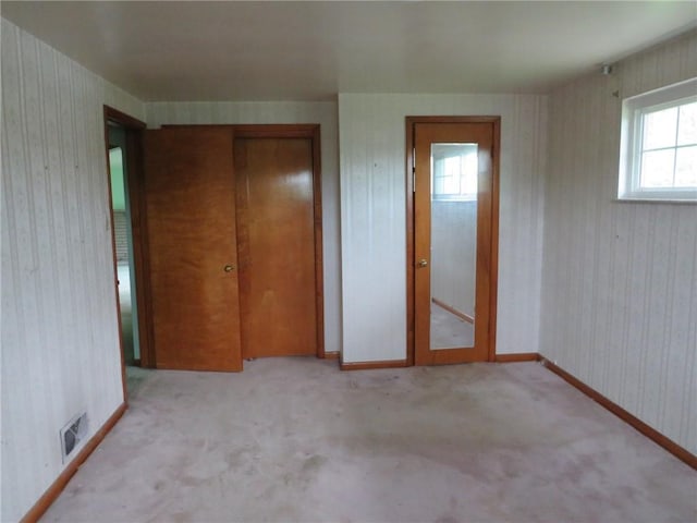 1185 Colgate Dr, Monroeville, PA 15146 - unfurnished bedroom with a closet, carpet floors, and wallpapered walls