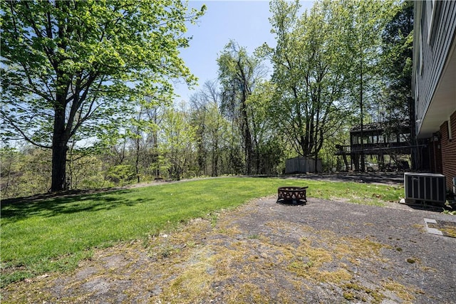 215 Wyngate Rd, Moon/Crescent Twp, PA 15108 - view of yard with central AC and an outdoor fire pit