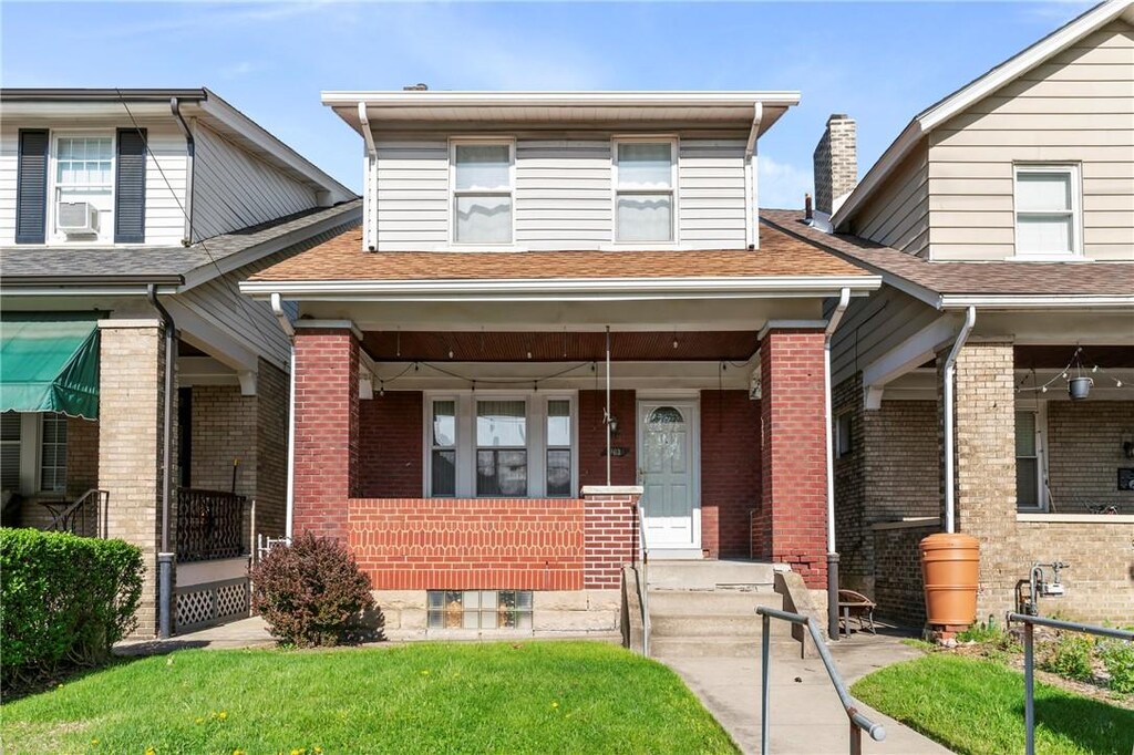 1163 Chislett, Morningside, PA 15206 - view of front of home with brick siding, a porch, a shingled roof, and cooling unit